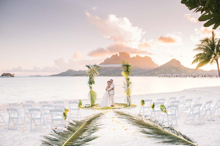 Sunset wedding ceremony at the Four Seasons Bora Bora